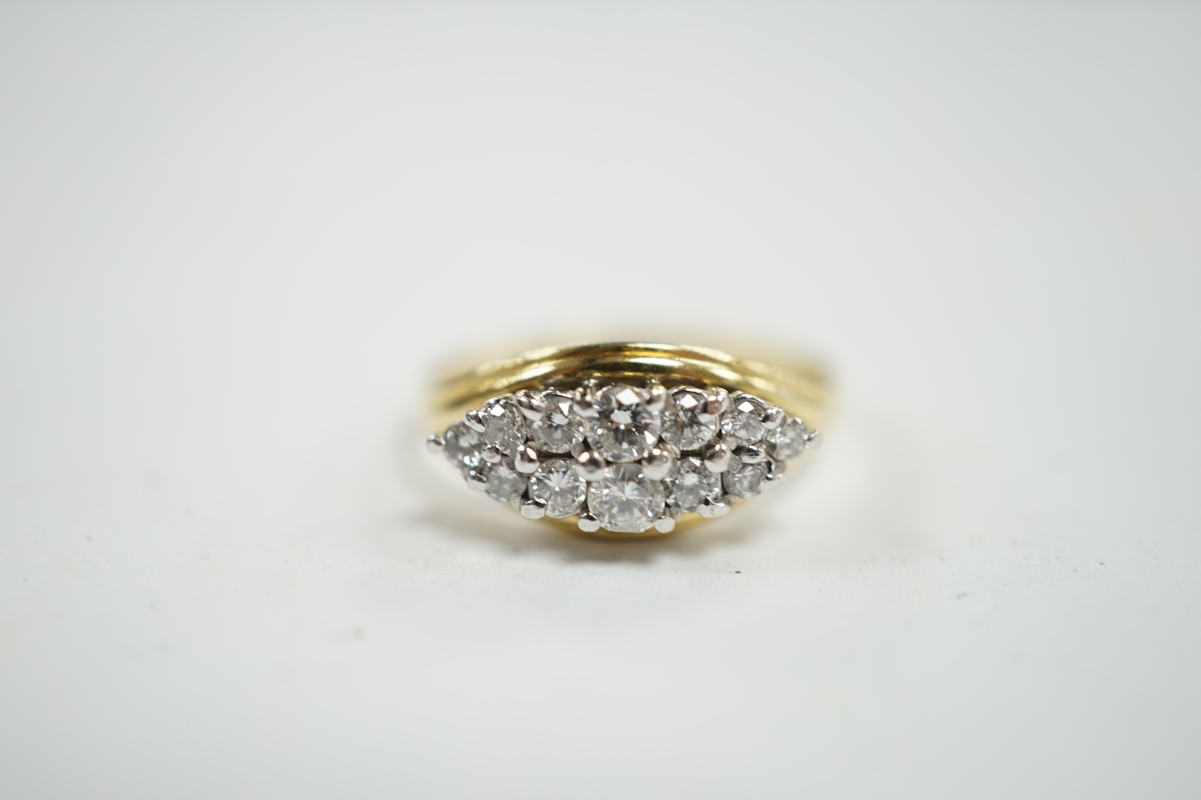 A modern 18ct gold and navette shaped diamond cluster set ring, size Q, gross weight 4.4 grams. Condition - fair